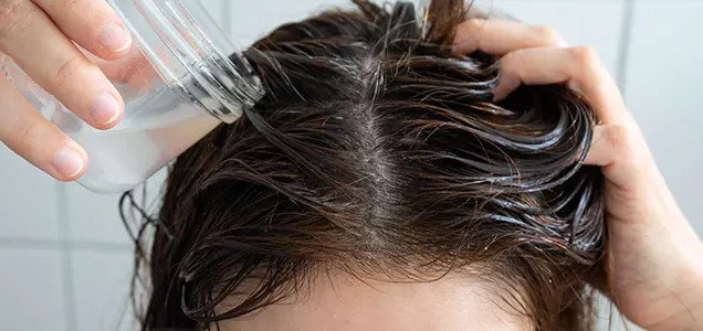 liquid treatment on scalp during GFC hair therapy