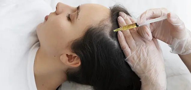Doctor injecting GFC treatment into scalp for hair growth